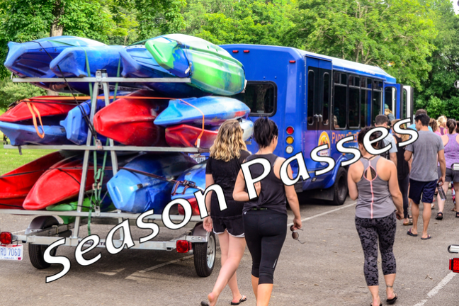 a group of people standing around a bus