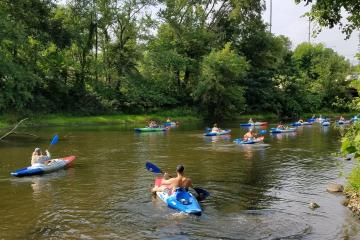 A group of People with kayak and Paddle