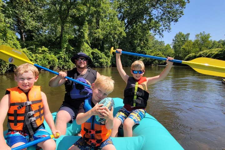 a group of people on a raft in a body of water